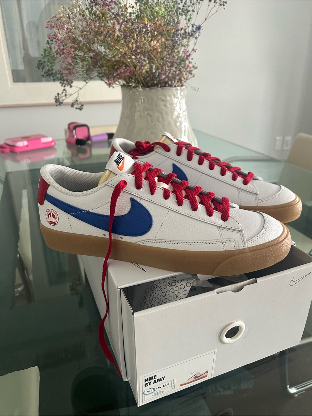 Nike White Leather Sneakers with Blue Swoosh and Red Laces